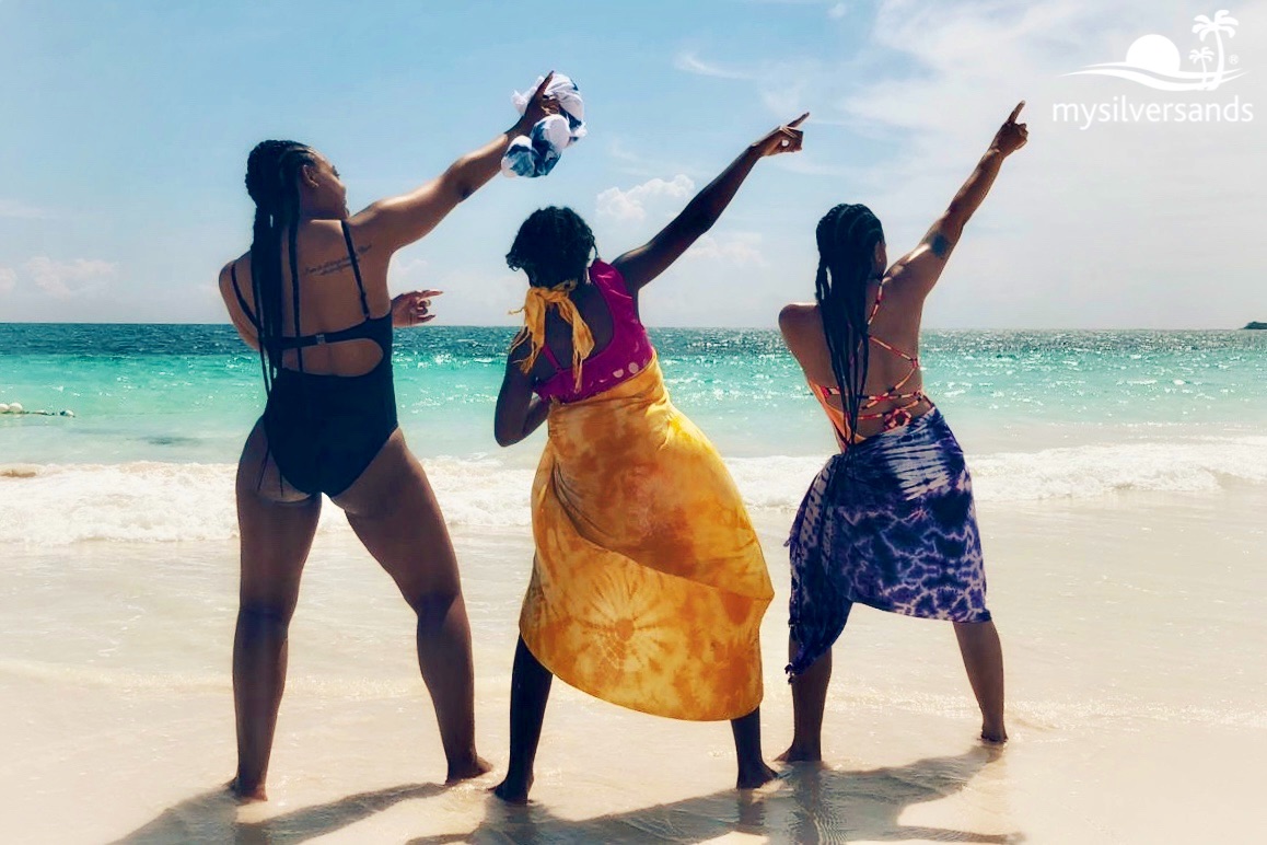 3 women on silver sands beach