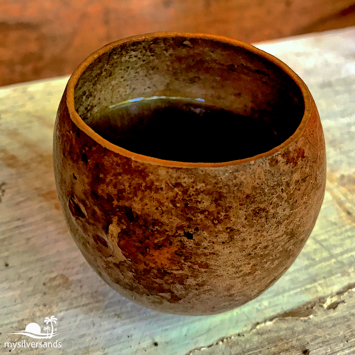 calabash cup with ganja tea