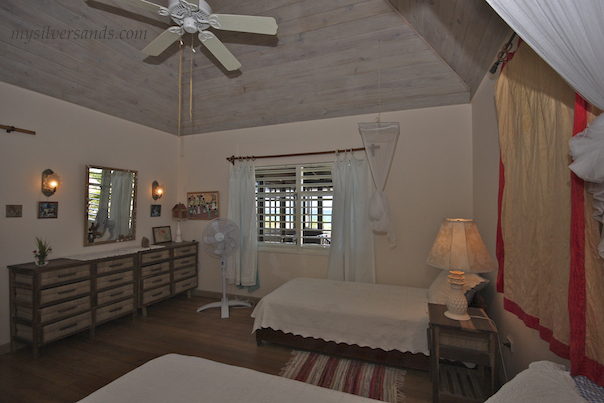 bedroom two of seashell cottage in silver sands has twin beds and a sea view