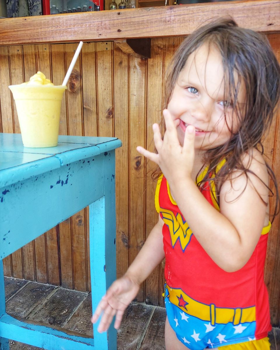 little girl with exotic drink