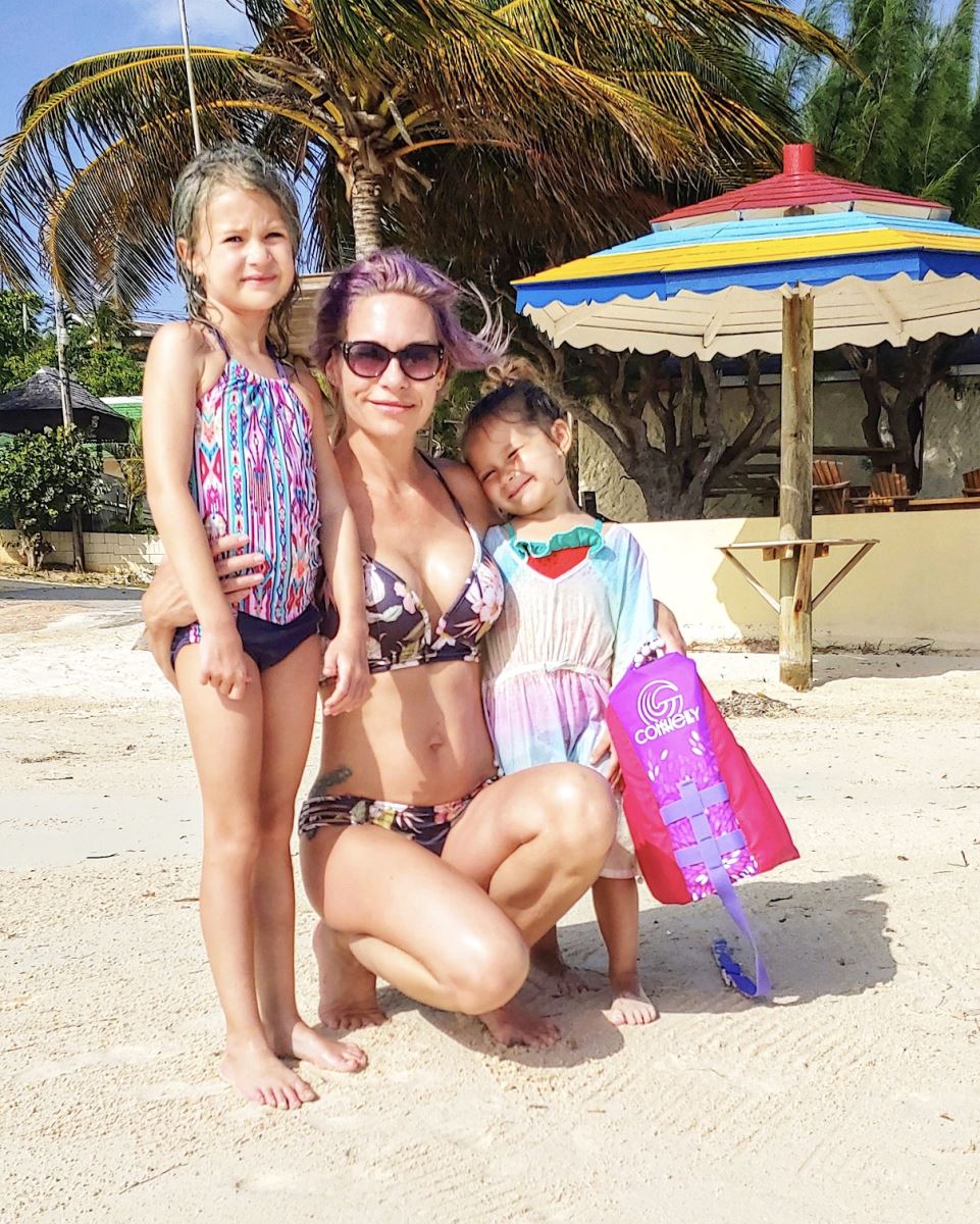 mother and daughters on the silver sands beach