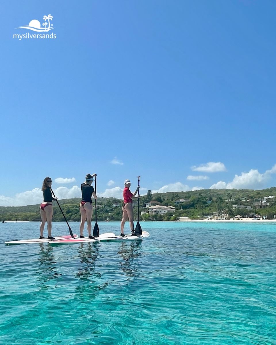 paddling past silver sands beach