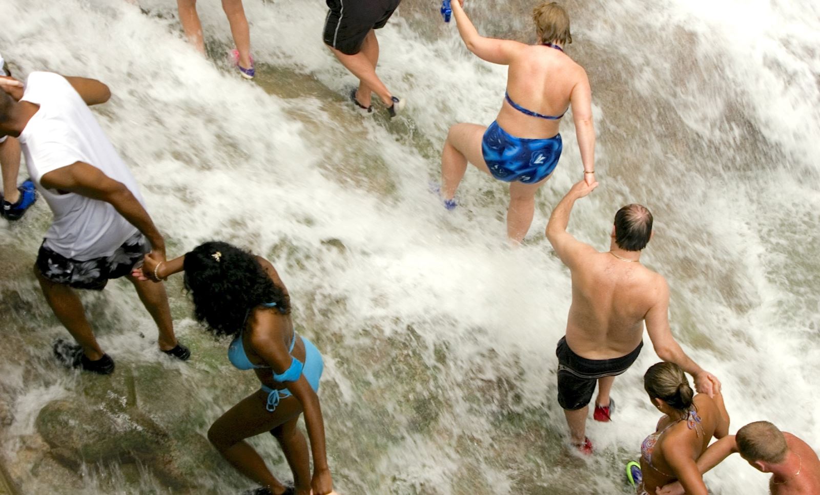 dunn's river falls human chain holding hands