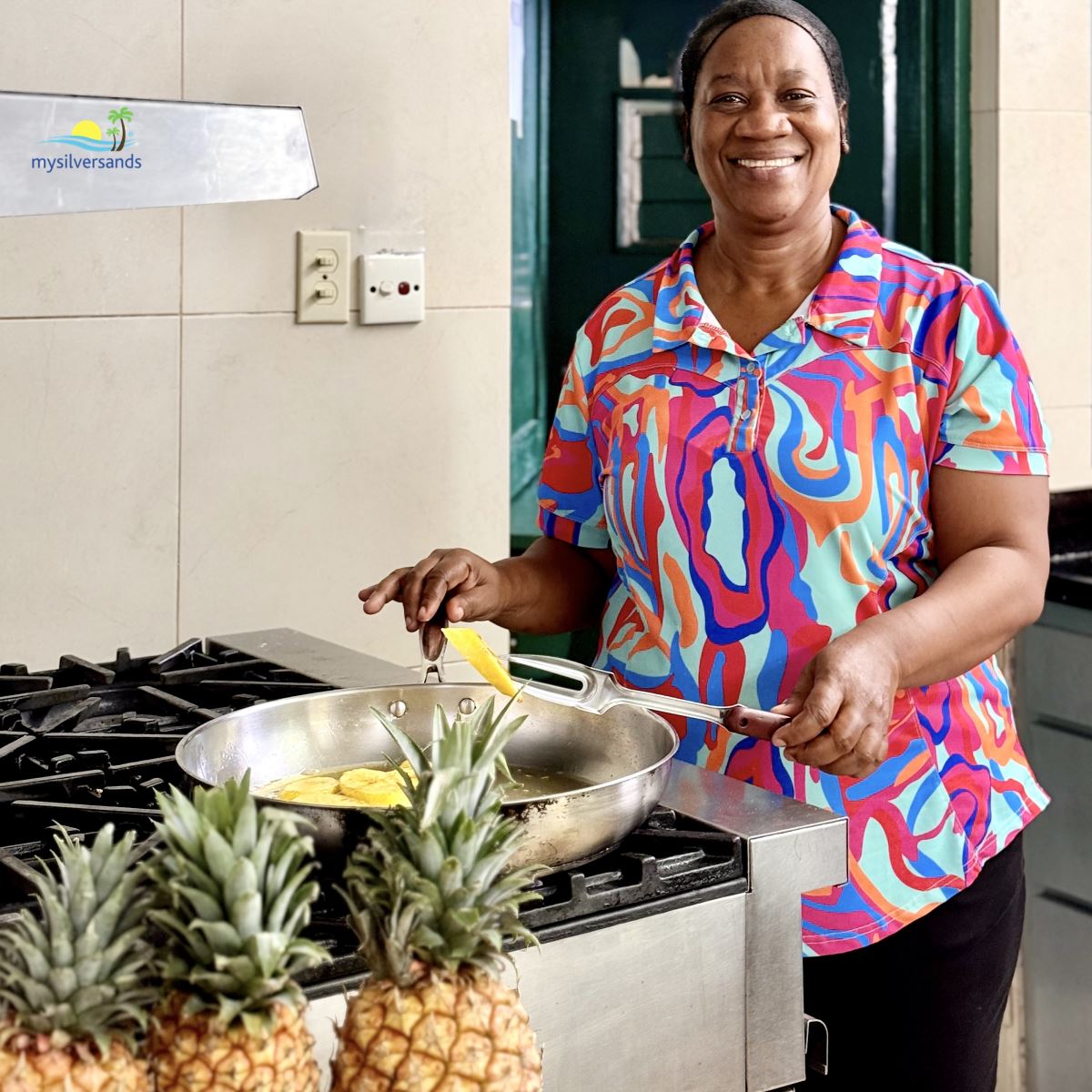 Pauline frying plantain at endless summer villa