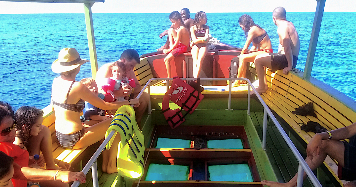 glass-bottom boat heading out to the reef